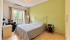 Cozy Green-Walled Bedroom Retreat.png