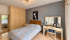 Warm Modern Bedroom Interior.png